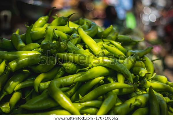 Hungarian wax pepper and Banana Pepper chili for sale\
on market background. selling green bajji chilli and mirchi bajji\
on market. Stock photo\
on