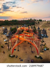 Dádpuszta, Hungary - 07 August, 2022 - Sunrise At The Ozorian Valley While People Dancing At The Main Stage. Psychedelic Tribal Gathering.