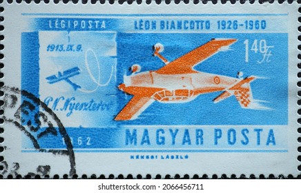 Hungary Circa 1962: A Post Stamp Printed In Hungary Showing A Historic Airplane: Stunt Plane And Nyesterov's 1913 Plane