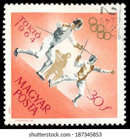 HUNGARY - CIRCA 1964: A Post Stamp Printed In Hungary Shows Fencing, Devoted To Olympic Games In Tokio, Series, Circa 1964 