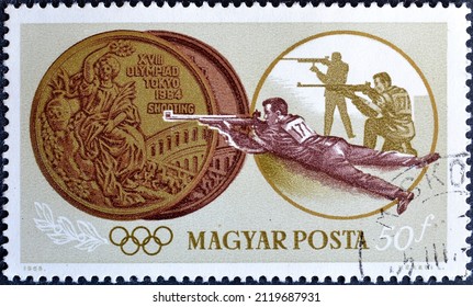 Hungary - Circa 1965 : Cancelled Postage Stamp Printed By Hungary, That Shows Medal And Rifle Shooting, 
Summer Olympic Games 1964 - Tokyo , Circa 1965.