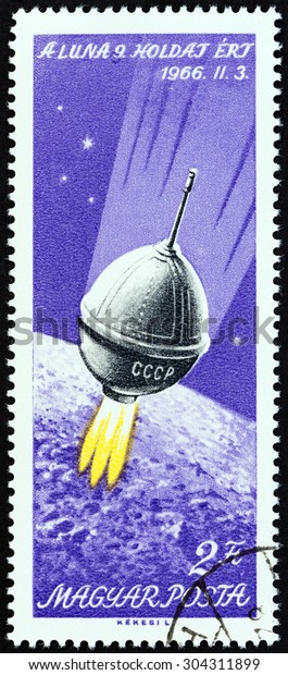 HUNGARY - CIRCA 1966: A stamp printed in Hungary issued\
for the Moon Landing of Luna 9 mission shows Luna 9 in space, circa\
1966. 