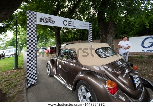 Hungary Szodliget Jun 22\
2019: Vintage VW bug convertible  sedan model on display in a mint\
condition. 