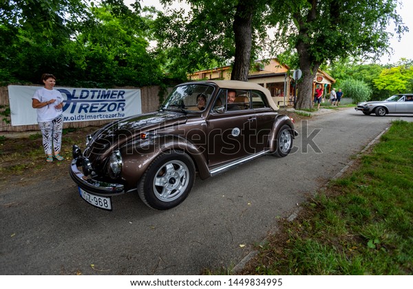 Hungary Szodliget Jun 22\
2019: Vintage VW bug convertible  sedan model on display in a mint\
condition. 