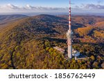 Hungary - TV tower in Pecs with Mecsek hills from drone view