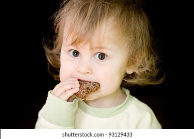 Hungry Baby Eating Bread