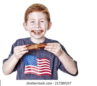 Hungry Boy Eating BBQ Rib In Studio