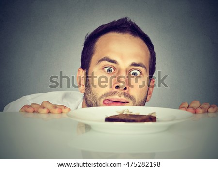 Hungry man craving sweet food 