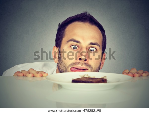 Hungry man craving sweet food
