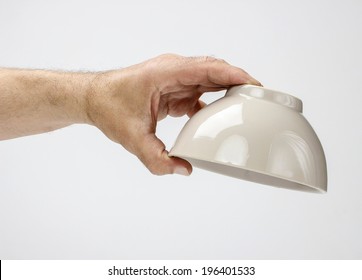 Hungry man holding empty bowl