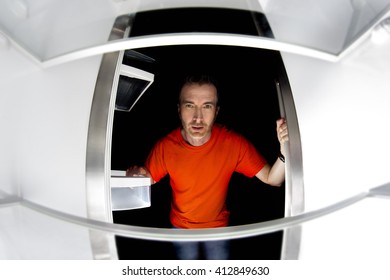 Hungry Man Looking For A Late Night Meal In An Empty Fridge