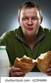 Hungry Man With Mouth Full Of Bread