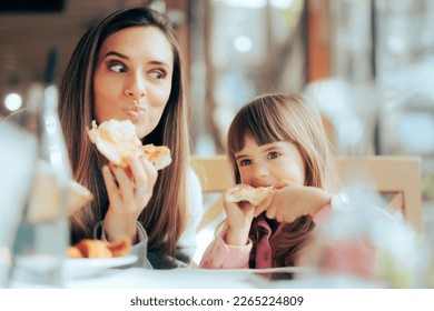 
Hungry Mom and Daughter Having Pizza in a Restaurant. Happy family craving for fast food meal
 - Powered by Shutterstock