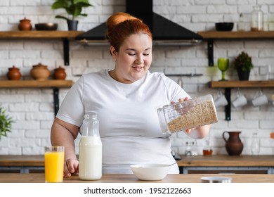 Hungry Starving Fat Caucasian Woman Cooking Healthy Dieting Breakfast. Plump Overweight Woman Eating Oat-flakes For Losing Weight And Calories Burn