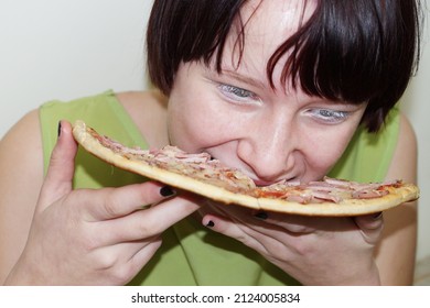 Hungry Teen Girl Impatiently Eating Pizza Close-up