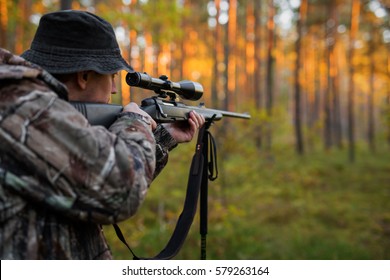 Hunter Aiming With Rifle