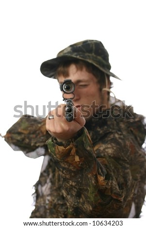 Hunter aiming rifle at camera