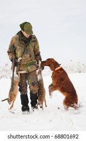 Hunter Getting The Hare From The Dog During A Winter Hunting Party