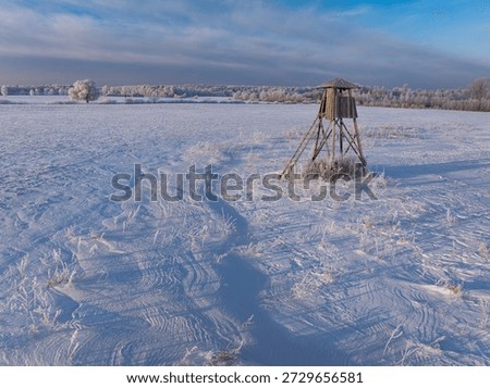 Hunter hide in the winter landscape