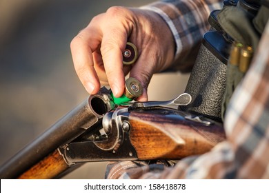 Hunter Holding A Rifle