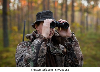 Hunter Looking Into Binoculars