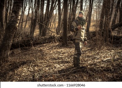 Hunter man autumn forest with transmitter during hunting season   - Powered by Shutterstock