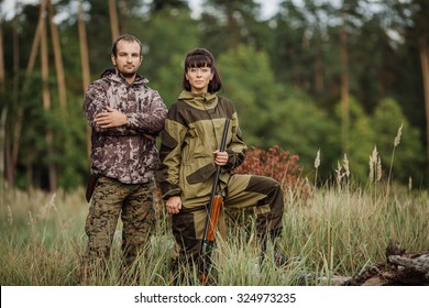 hunters in camouflage clothes ready to hunt with hunting rifle