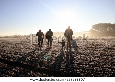 Hunting crew heading out to hunt, early november morning in Denmark.