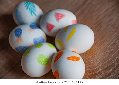 Hunting eggs. Painted eggs. Easter eggs on wooden table. Happy Easter holiday celebration. Easter bunny hunt. Spring holiday at Sunday. Eastertide and Eastertime. Good Friday. Copy space.