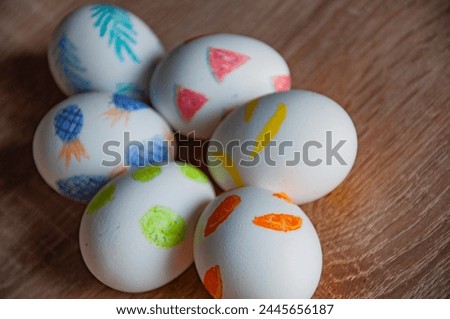 Hunting eggs. Painted eggs. Easter eggs on wooden table. Happy Easter holiday celebration. Easter bunny hunt. Spring holiday at Sunday. Eastertide and Eastertime. Good Friday. Copy space.