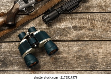 Hunting Equipment Binoculars On Wooden Background Close Up