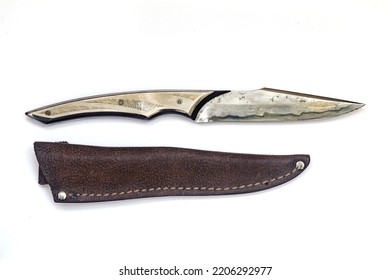 Hunting Knife And Sheath Made Of Leather On A White Background, Damascus Steel Blade, Metal Handle,  Author's Work