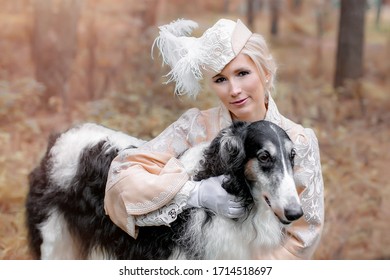 Hunting young woman in the forest with dogs