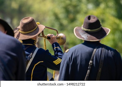 Huntington Beach, CA / USA - August 31, 2019: A Union Soldier Plays The Trumpet At The End Of An American Civil War Reenactment 