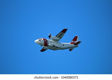 Huntington Beach, CA, USA - February 16, 2017: Coast Guard Plane Flying Over The Huntington Beach Pier