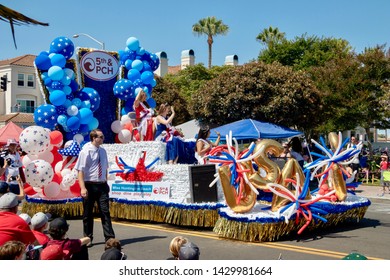 Huntington Beach, CA / USA - July 4, 2018: Miss Huntington Beach riding a float in the 4th of July parade in Huntington Beach, California 