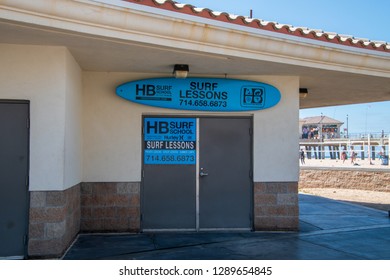 Huntington Beach, California - October 11, 2018: Signs On A Building Promoting Surf Lessons With One Sign In The Shape Of A Surfboard Were Seen Here On This Date