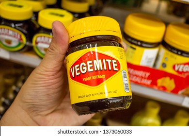 Huntington Beach, California/United States: 04/07/2019: A hand holds a container of Vegemite at the grocery store