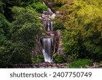 Huntington Falls, an artificial waterfall flowing from the top of Strawberry Hill and into Stow lake, Golden Gate Park, San Francisco, California
