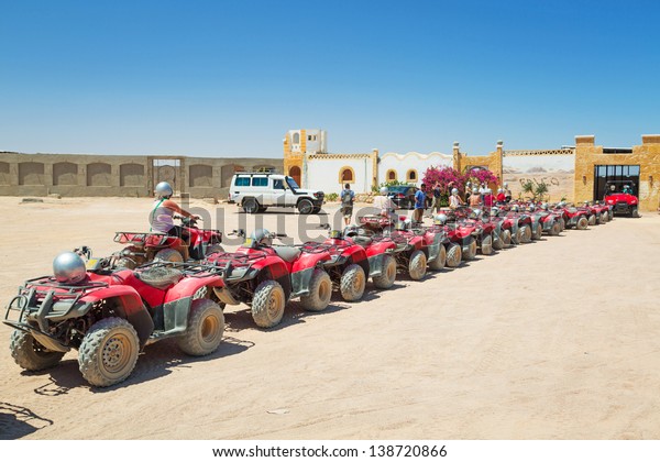 HURGHADA, EGYPT -\
APR 16: Unidentified people starting quad trip on the desert near\
Hurghada on 16 April 2013. Desert safari is one of the main local\
tourist attraction in\
Egypt.