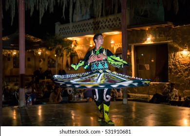 HURGHADA, EGYPT - NOVEMBER 27, 2016: Sufi whirling is a form of Sama or physically active meditation which originated among Sufis, which is still practiced by the Sufi Dervishes of the Mevlevi order.