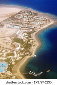 Hurghada, Egypt, The Resort Part Of The City. Red Sea Coast, Tourist Hotels On The Coast. Aerial View From The Airplane Window.