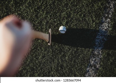 Hurl And Sliotar On GAA Pitch