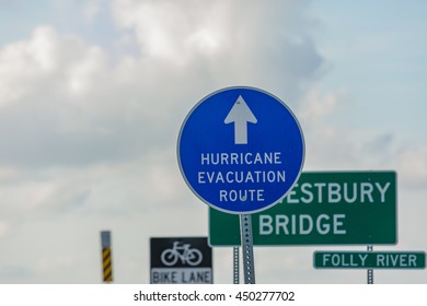 Hurricane Evacuation Route Sign Among Other Signs.