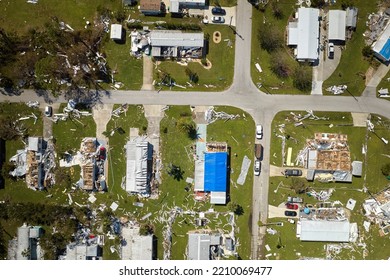 Hurricane Ian Destroyed Homes In Florida Residential Area. Natural Disaster And Its Consequences