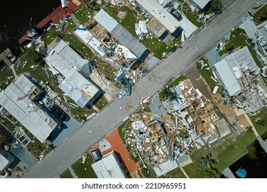 Hurricane Ian Destroyed Homes In Florida Residential Area. Natural Disaster And Its Consequences