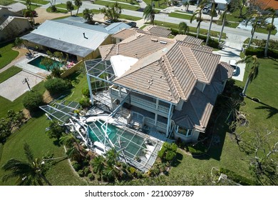 Hurricane Ian Destroyed House In Florida Residential Area. Natural Disaster And Its Consequences