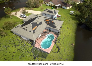 Hurricane Ian destroyed house roof in Florida residential area. Natural disaster and its consequences - Shutterstock ID 2210069455