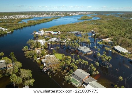 Hurricane Ian flooded houses in Florida residential area. Natural disaster and its consequences