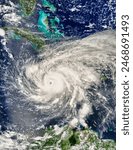 Hurricane Ivan 09L off Jamaica afternoon overpass.  Elements of this image furnished by NASA.